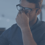 A man looking stressed and tired. Exhausted