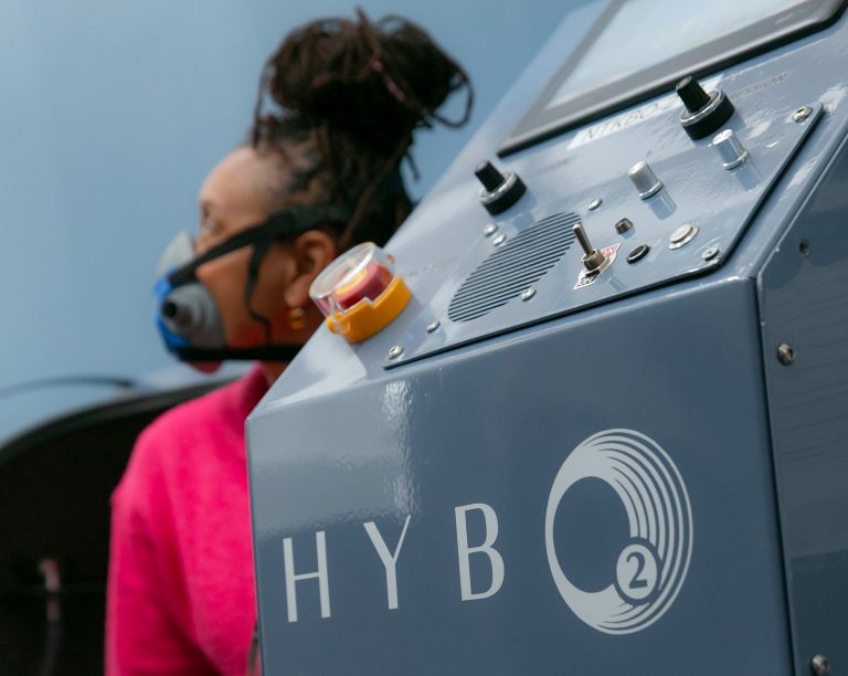 A client at HybO2 House being shown into the hyperbaric chamber ready for therapy